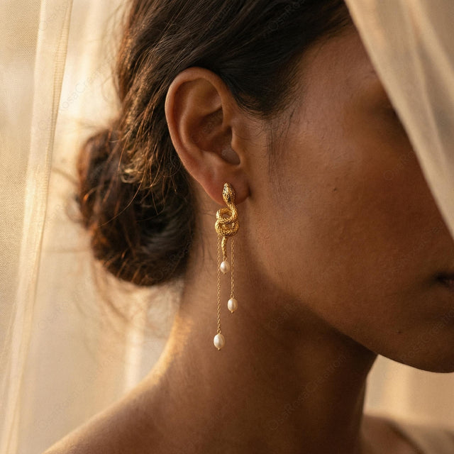 Serpent Pearl Tassel Earrings worn by a model